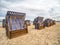 Roofed wicker beach chairs