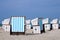 Roofed wicker beach chairs