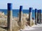 Roofed wicker beach chairs at the beach