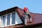 Roofer builder worker on roof