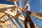 Roofer,builder working on roof structure of building on construction site