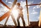 Roofer carpenter working on roof on construction site