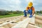 Roofer carpenter works on roof