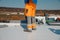 Roofer man works on a flat roof with pvc membrane insulation system