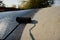 Roofer worker painting black coal tar or bitumen