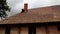Roofers fixing the cedar wooden shingle roof