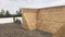 Roofers repairing areas of a commercial flat roof, wood panel base of a built up wall