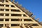Roofing construction, framing the rooftop with roof beams, trusses, braces and boards before sheathing, underlayment and roof