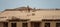 Roofing on roof. Builder roofer install new roof. Construction worker roofing on a large roof apartment building