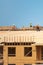 Roofing on rooftop. Builder roofer install new roof. Construction worker roofing on a large roof apartment building