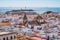 Roofs of the city of CÃ¡diz with tower of San Lorenzo church and San Sabastian castle on the sea in the background, SPAIN