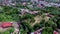 Roofs of houses in a messy, ill planned city housing community. Drone aerial