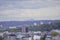 Roofs of houses and mountain at sunset, the dark sky with clouds before a thunderstorm. old town top view. the observation deck on