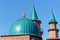 Roofs of mosque under construction against clear blue sky