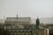 Roofs panorama with towers of the Poland city KrakÃ³w during the winter day with grey overcast sky