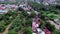 Roofs of slum and squatter houses built along railway road. Drone aerial