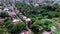 Roofs of slum and squatter houses built along railway road. Drone aerial