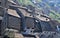 Roofs in the sun with a smoking fireplace and houses seen from the Castruccio tower in Ghivizzano in the province of Lucca, one of