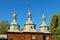 The rooftop of ancient wooden church at autumn day. Museum of Folk Architecture and Life of the Middle Naddnipryanshchyna