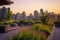 Rooftop Garden Terrace with Urban Skyline at Sunset. Resplendent.