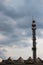 Rooftop of industrial halls and an inactive municipal heating plant chimney converted into a mast for telecommunications antennas