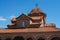 Rooftop of modern monastery on sky background.