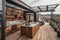 A rooftop patio and an open kitchen with sliding glass doors.