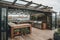 A rooftop patio and an open kitchen with sliding glass doors.