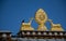 Rooftop statues of two golden deer and Dharma wheel in Tibetan Temple