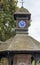 The rooftop tower of an old wooden round Gazebo with the legend