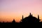 Rooftop view panorama with ancient architecture silhouettes  in Italy and soft vanilla sky.