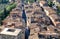 Rooftop view on Tuscany cityscape. San Gimignano town houses and narrow streets with crowd of tourists, Italy