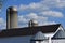 Rooftops of barn, silos and corn cribs