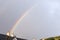 Rooftops with a bright coloured Rainbow