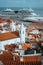 Rooftops, church of Alfama district in Lisbon. Cruise boat on the Tagus River. Lisbon Lisboa Lissabon