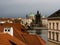 Rooftops of Mala Strana neighborhood with view of Charles Bridge in Prague