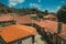 Rooftops of old houses with chimneys and deserted alley