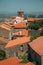 Rooftops of old houses with church steeple in Monsanto