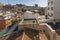 Rooftops and roofs of different heights with antennas and chimneys