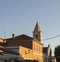 rooftops with tower of medieval church build from stone in the city of Nin