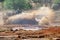 Rooikat armoured reconnaissance vehicle driving through muddy water