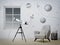 Room and armchair with telescope at the window and planets graphic wallpaper