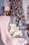 Room decorated for the new year, in soft pastel colors, cute bears in an armchair. Christmas mood