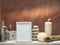 Room decoration with candles, rocks, bottle with black sand and picture frame mockup on white shelf against old brick color wall