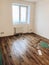 room floor renovation concept. stylish wooden laminate instalation, modern white walls. repairing and working in home, space for