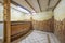 Room on the ground floor of a single-family house dedicated to a cellar with a wooden bar