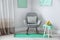 Room interior with comfortable armchair. Mint color decors