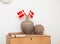 Room interior. Two vases on the chest of drawers and Danish flags and a wall clock.