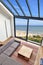 Room with large windows and view on seaside