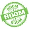 ROOM text on green round stamp sign